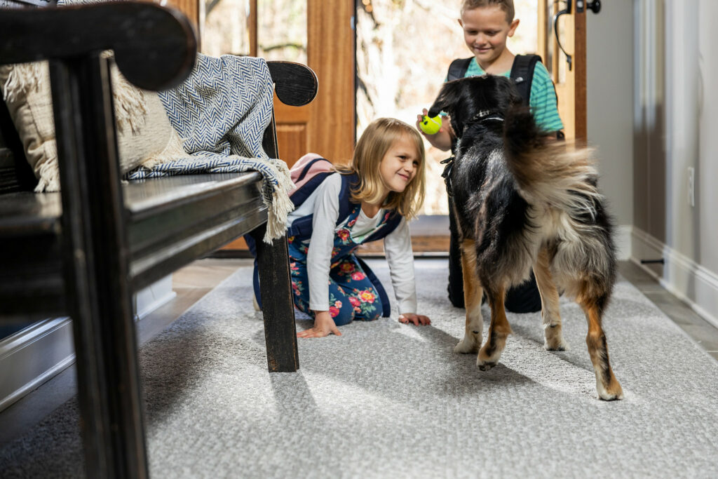 Kids on carpet flooring with pet friendly | Hadinger Flooring