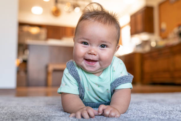 Baby on carpet flooring | Hadinger Flooring